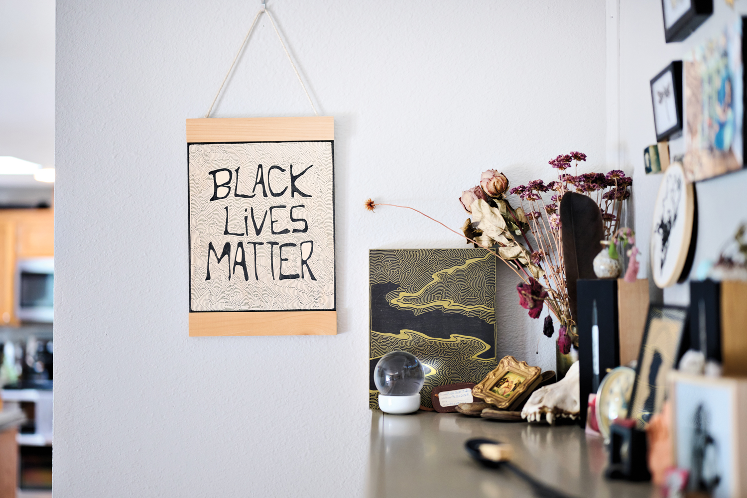 part of studio with Black Lives Matter poster