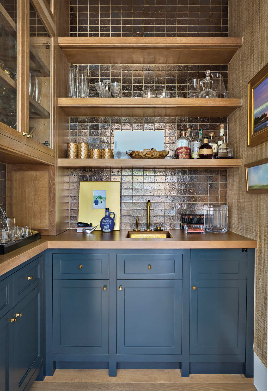 Bar with blue cabinetry, wood...