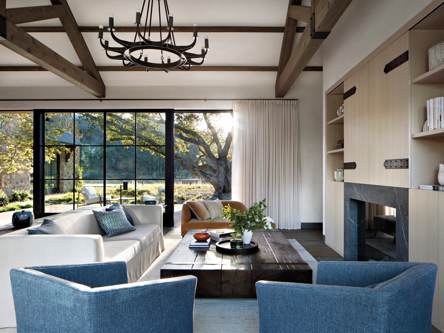 Family room with blue armchairs,...