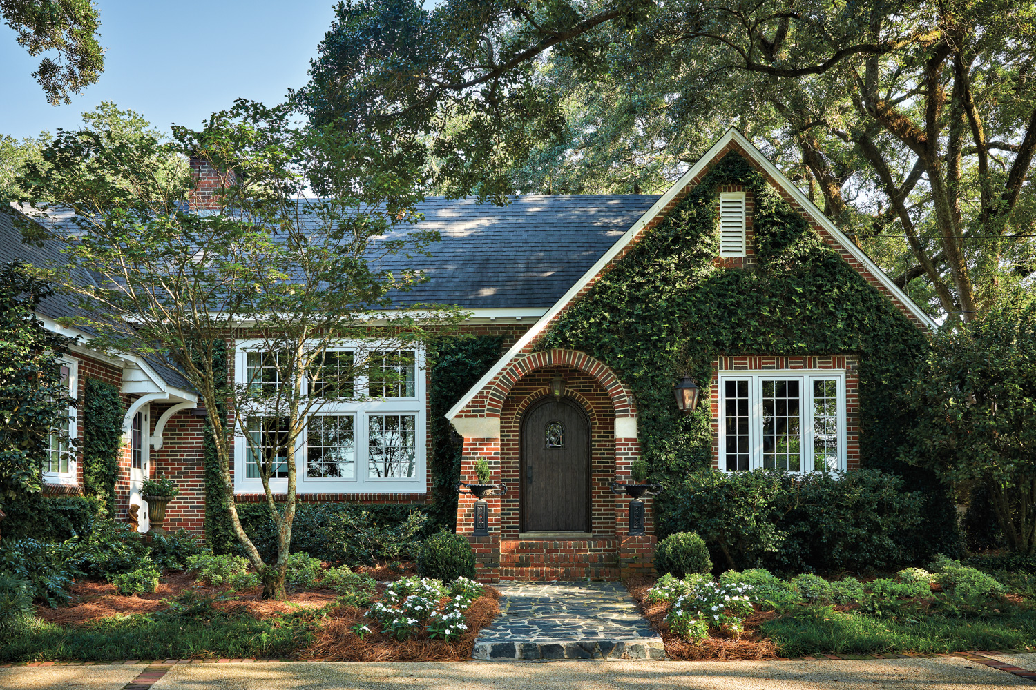 Charming ivy-covered brick cottage by...