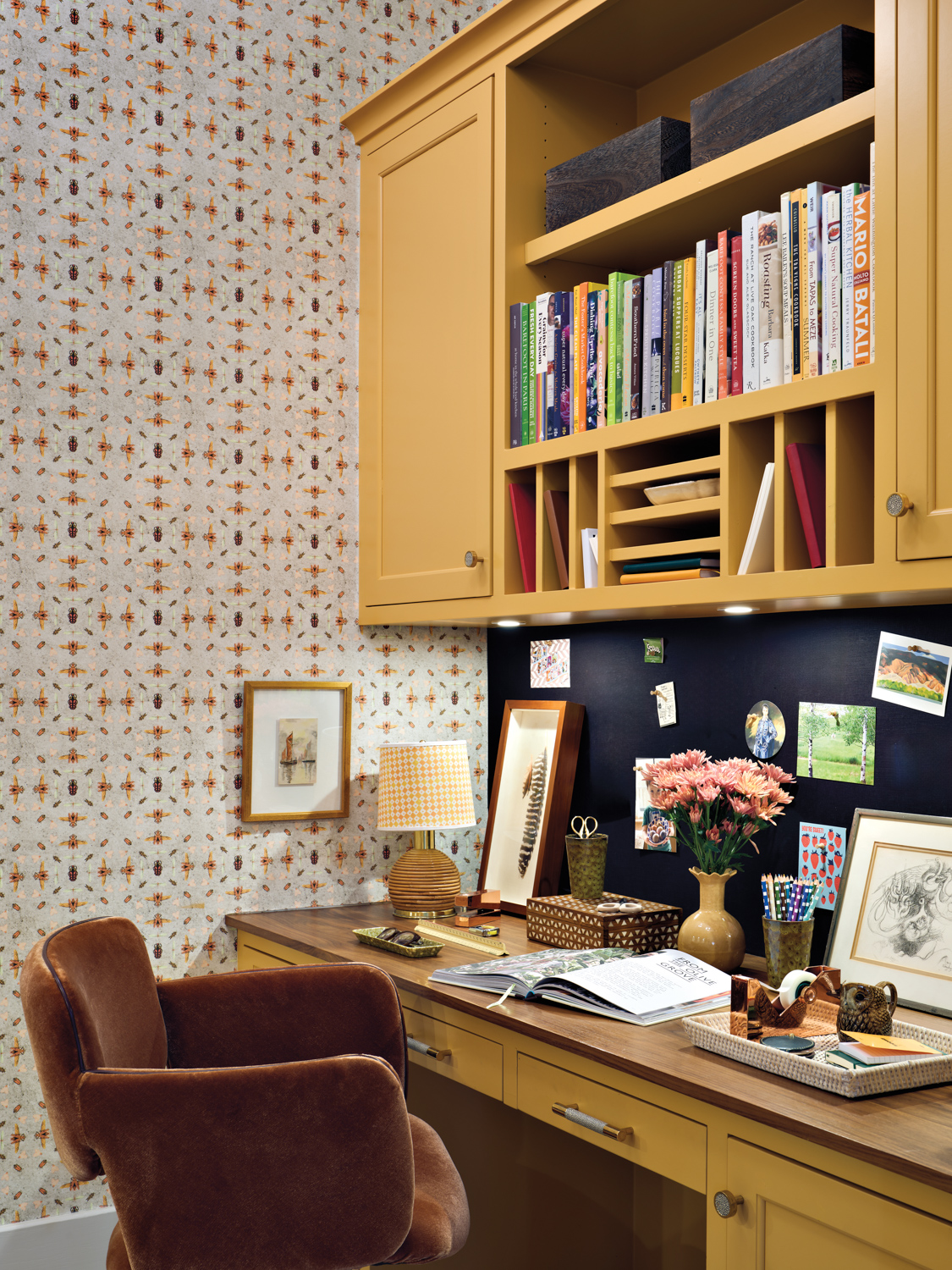 Home office with yellow cabinetry,...