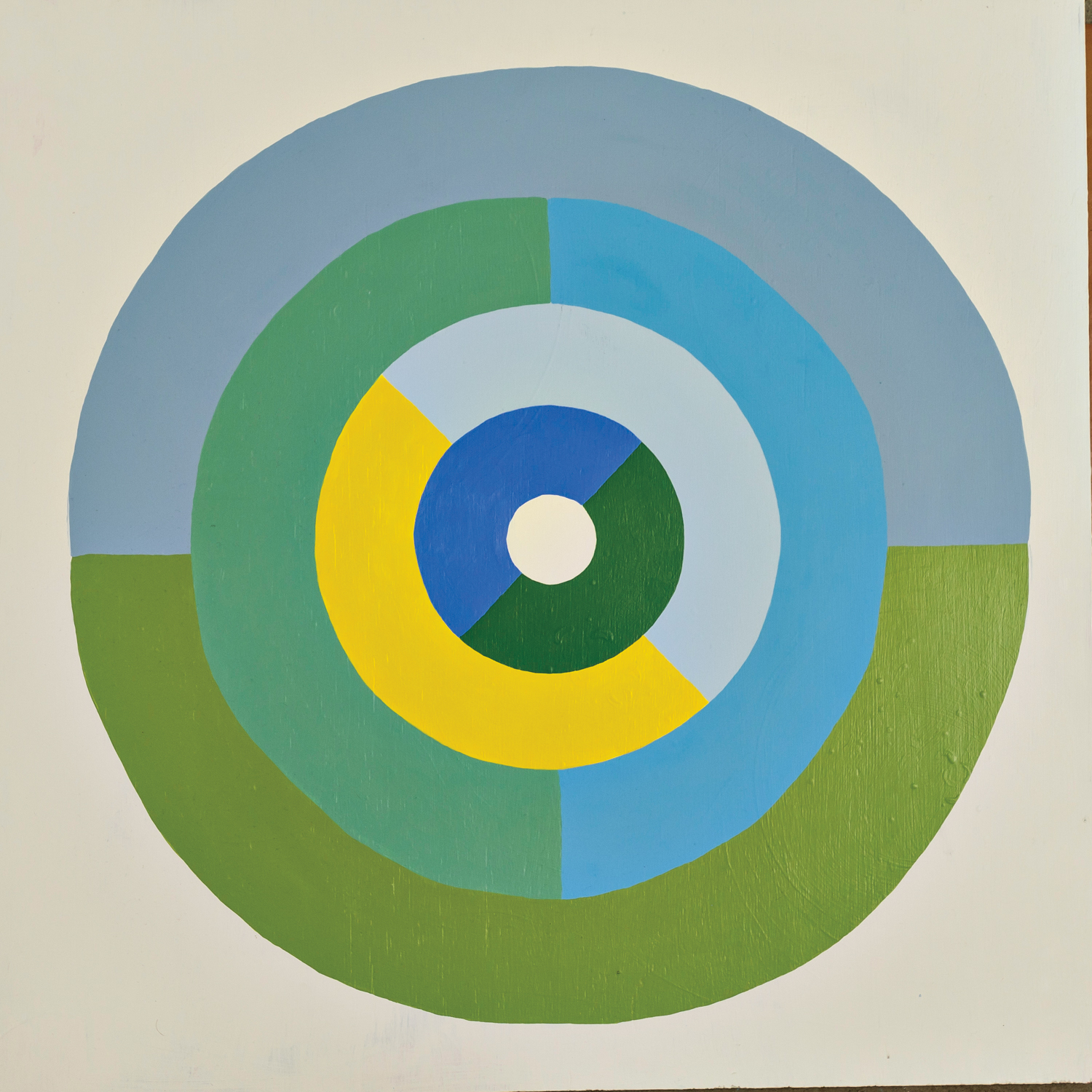Artwork featuring concentric circles in shades of blue, green and yellow.