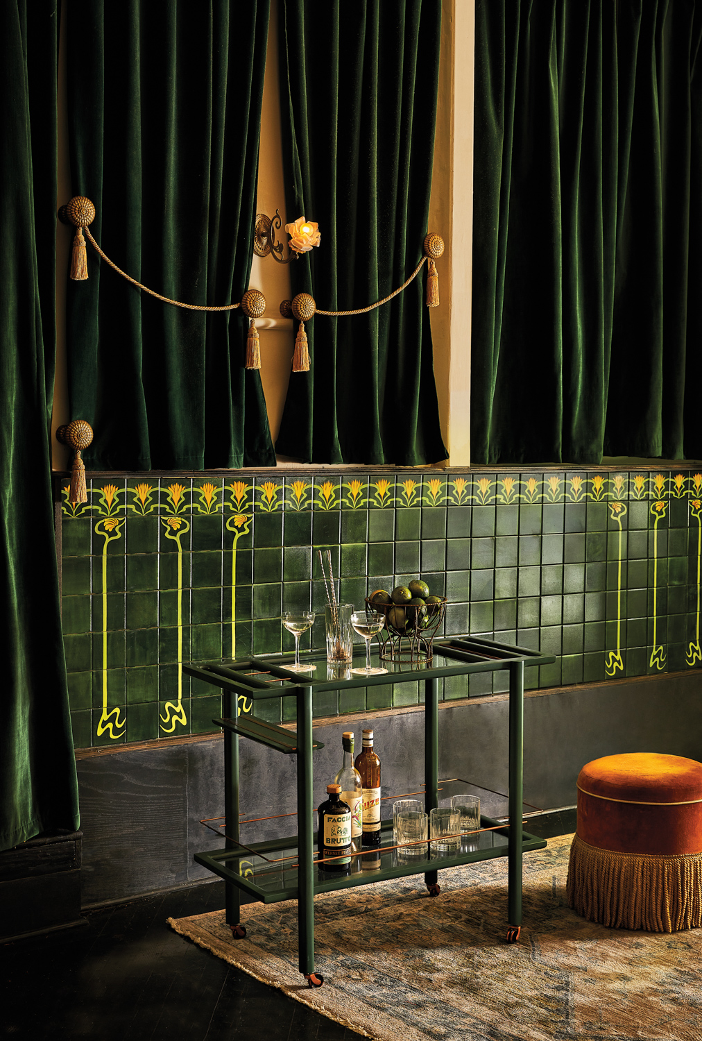 a deep green lacquer and copper accented bar cart by Chris and Amber Earl
