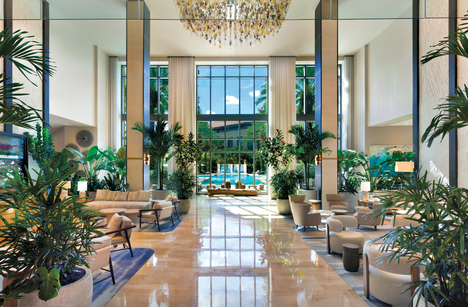 Hilton West Palm Beach's lobby full of tropical greenery