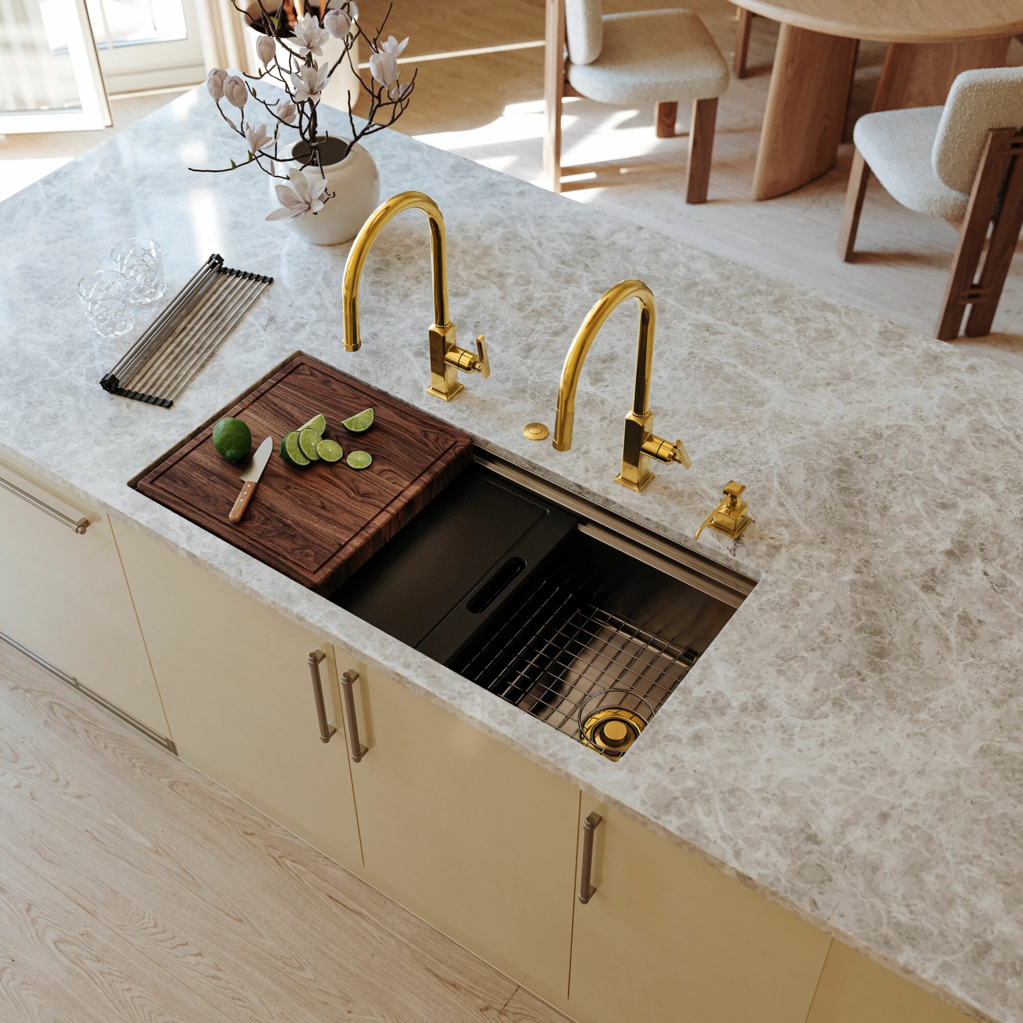 gold double faucets within a modern kitchen island were on view at KBIS 2024