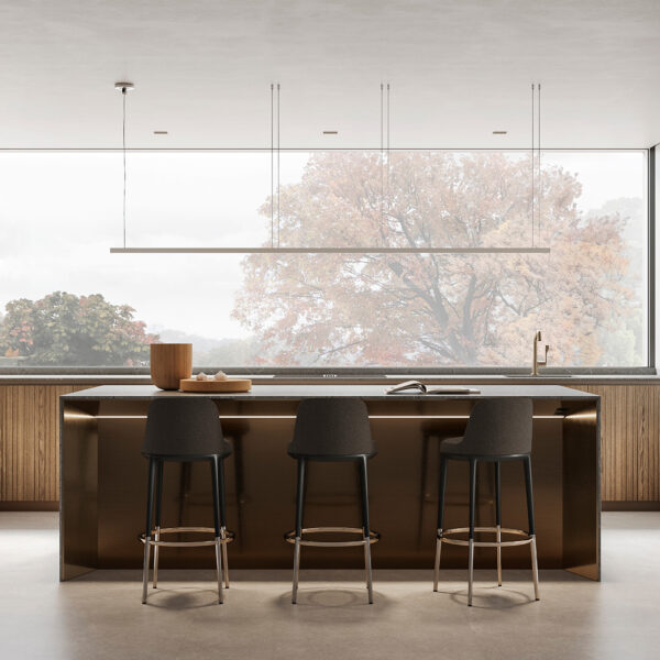 Sleek kitchen featuring wooden cabinets, stools, and a kitchen island with seating.