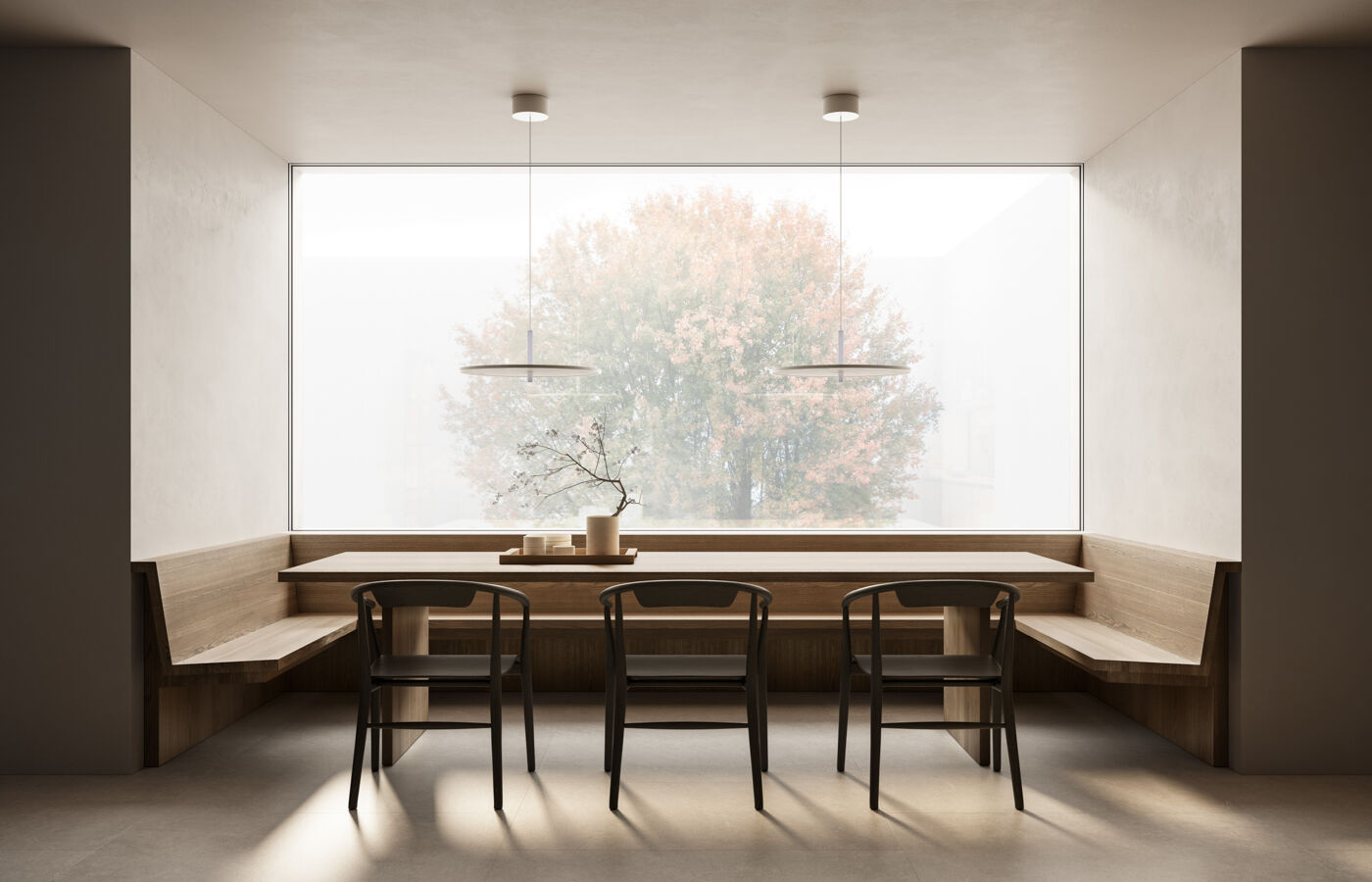 A well-lit dining room with a wooden table and comfortable chairs, inviting for a meal or gathering.