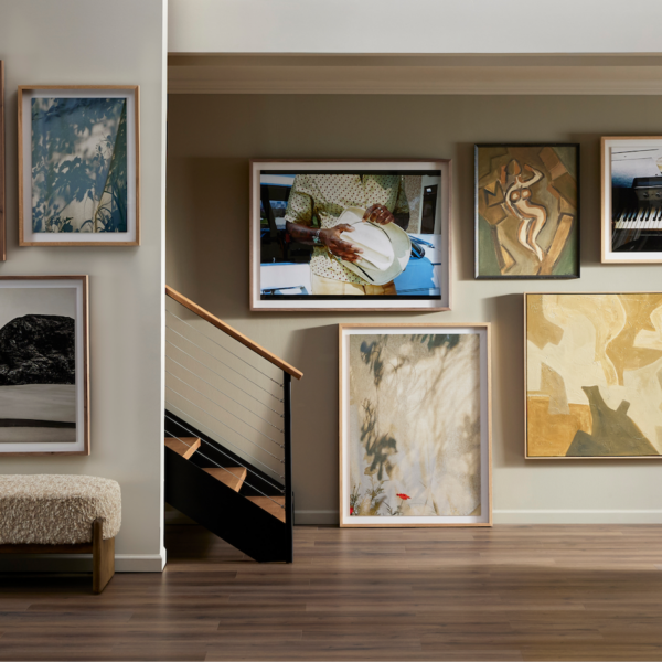 a staircase with art on the wall