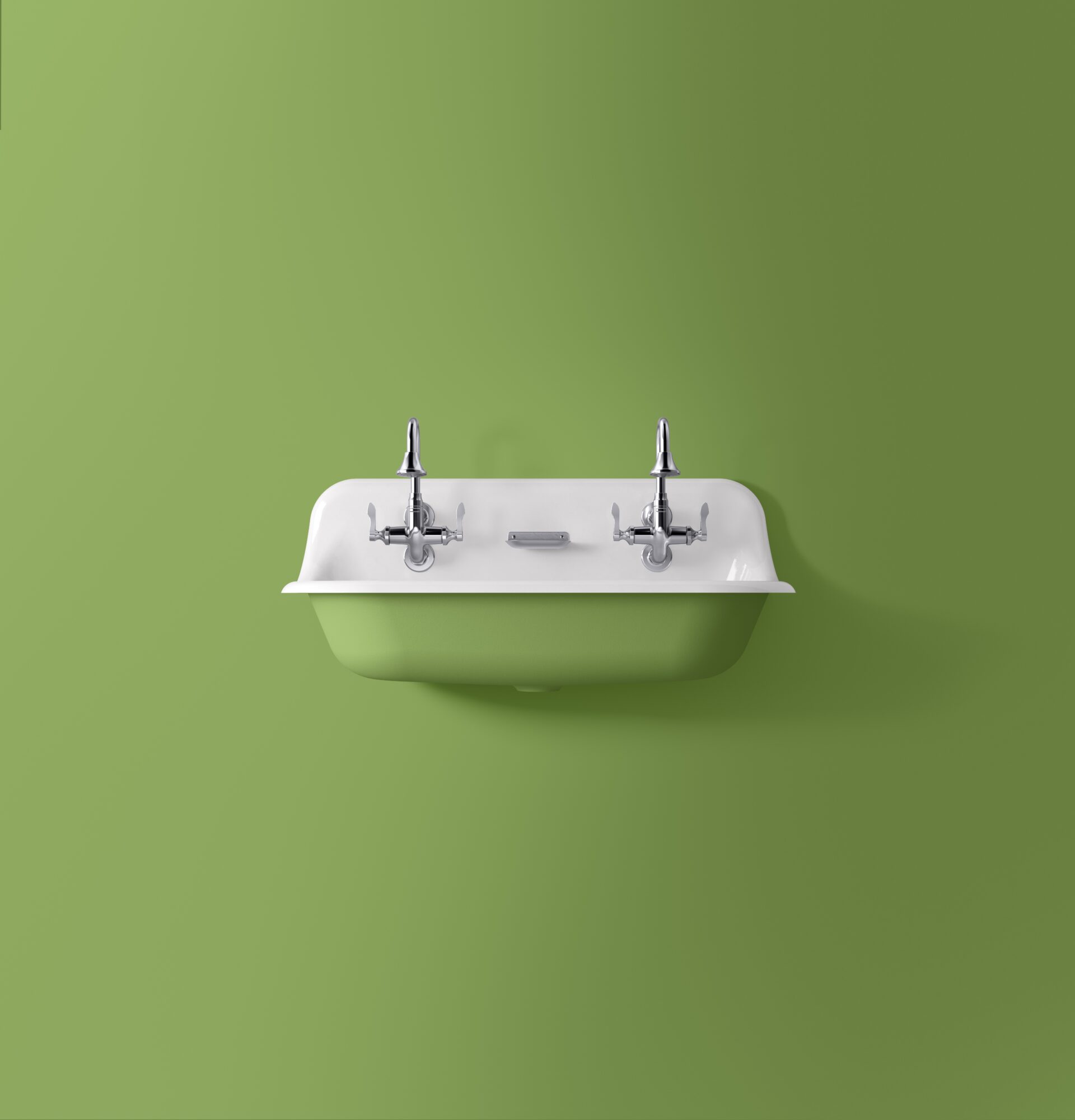 Kohler sink against a bright green painted wall as presented at KBIS 2024