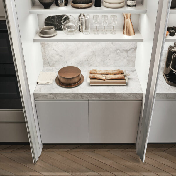 Modern kitchen featuring white cabinets.