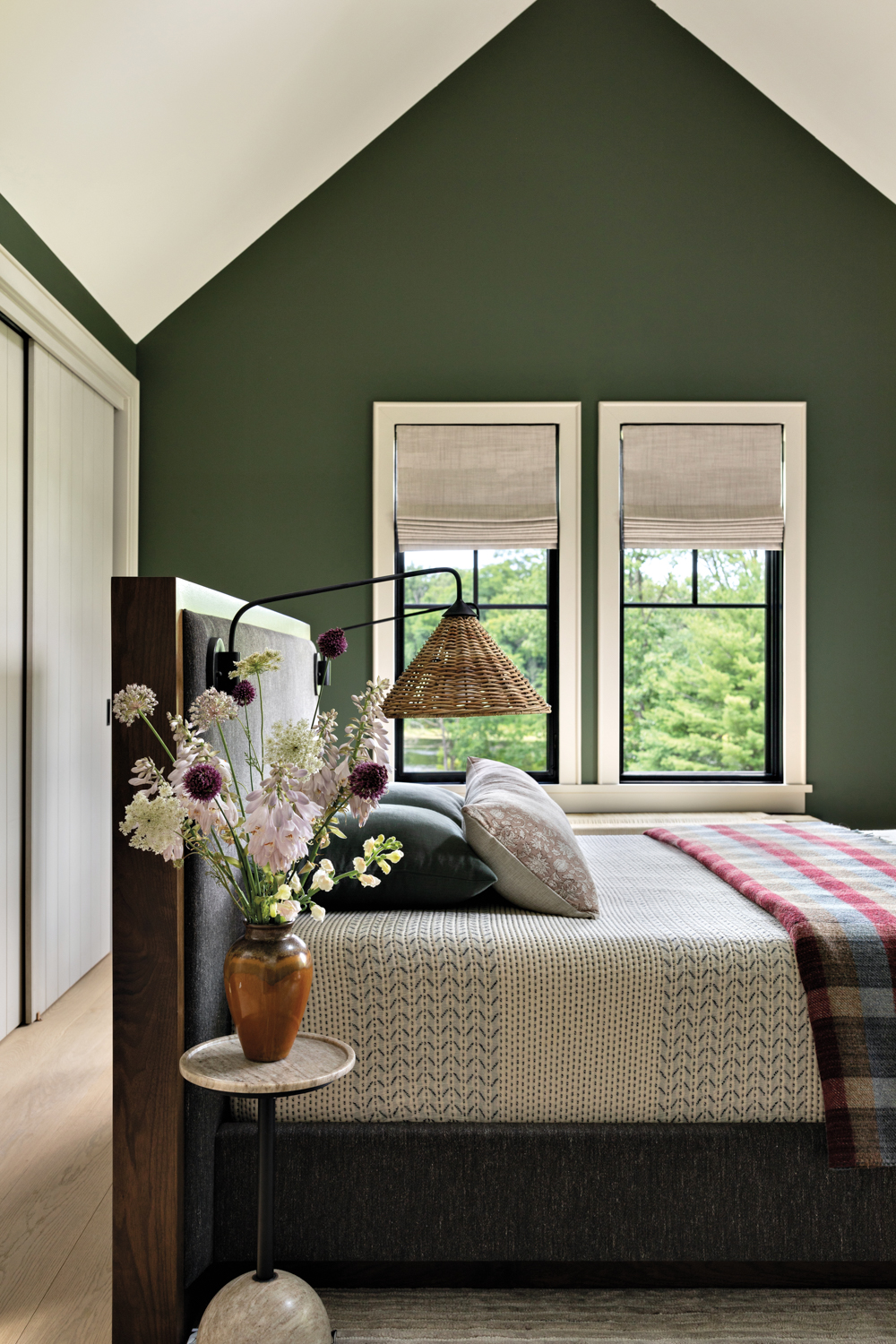 bedroom with vaulted ceiling, green...