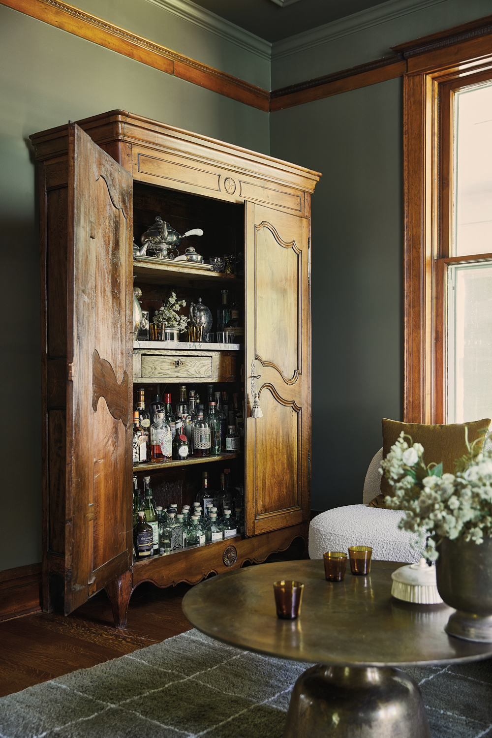 antique armoire serves as a...
