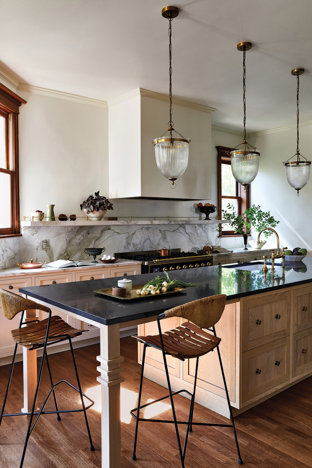 kitchen with dark quartzite-topped wood...