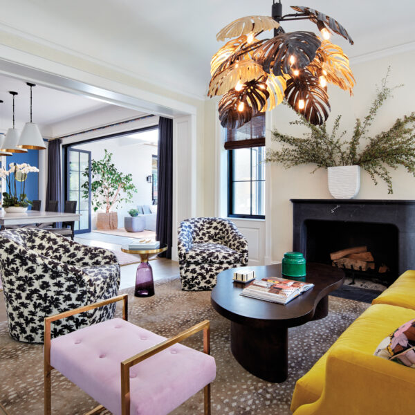 bright and eclectic living room with yellow, pink and black-and-white furnishings
