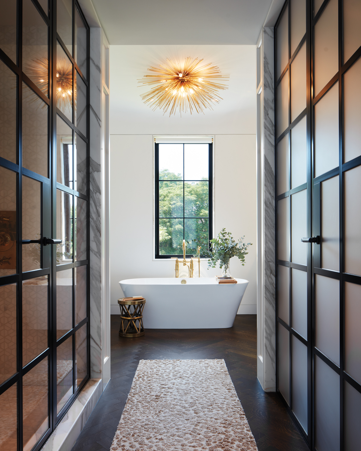 steel-and-glass closet doors line the...