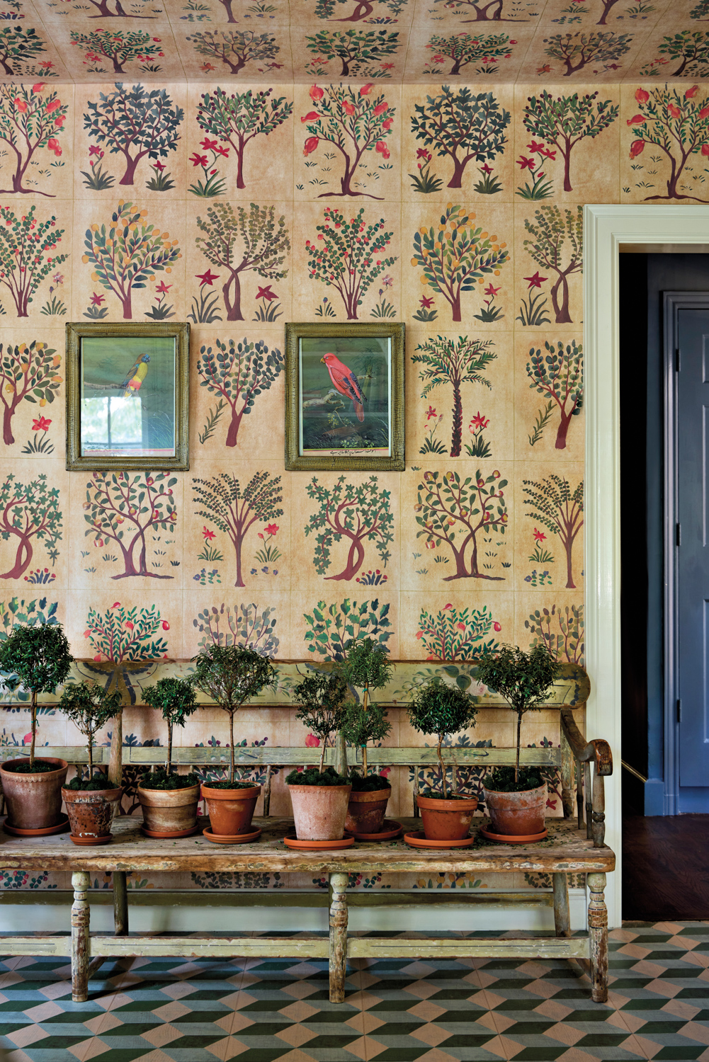 Kips Bay room with botanical wallpaper, framed birds, and geometric floors