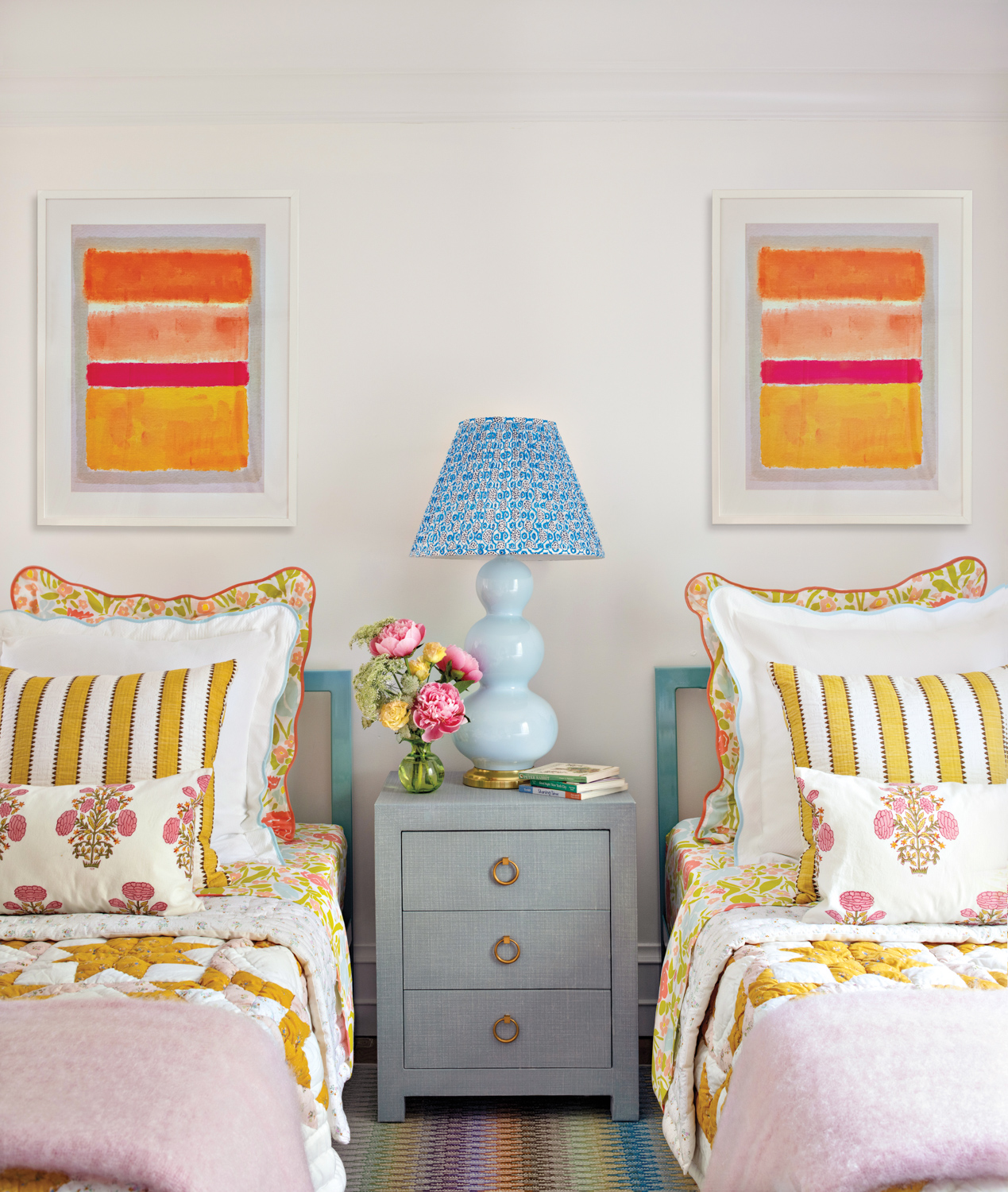 colorful twin beds in a...