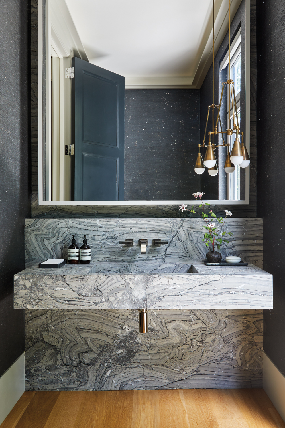 powder room with marble vanity