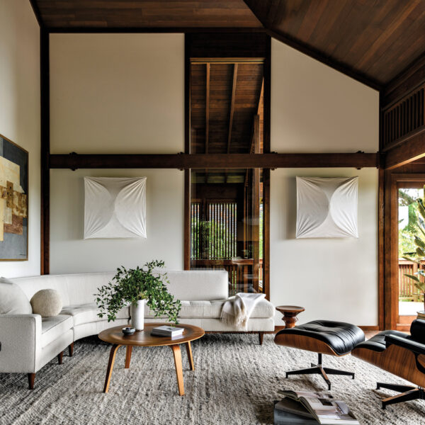 living room with high ceilings and wooden beams