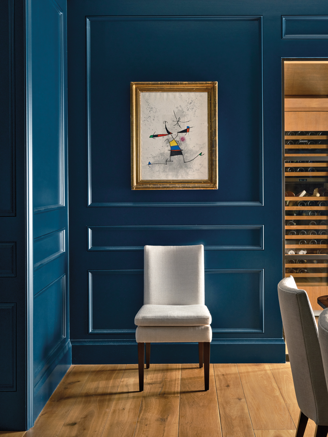 Blue dining room with artwork...