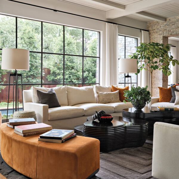 modern living room with large windows and sofas