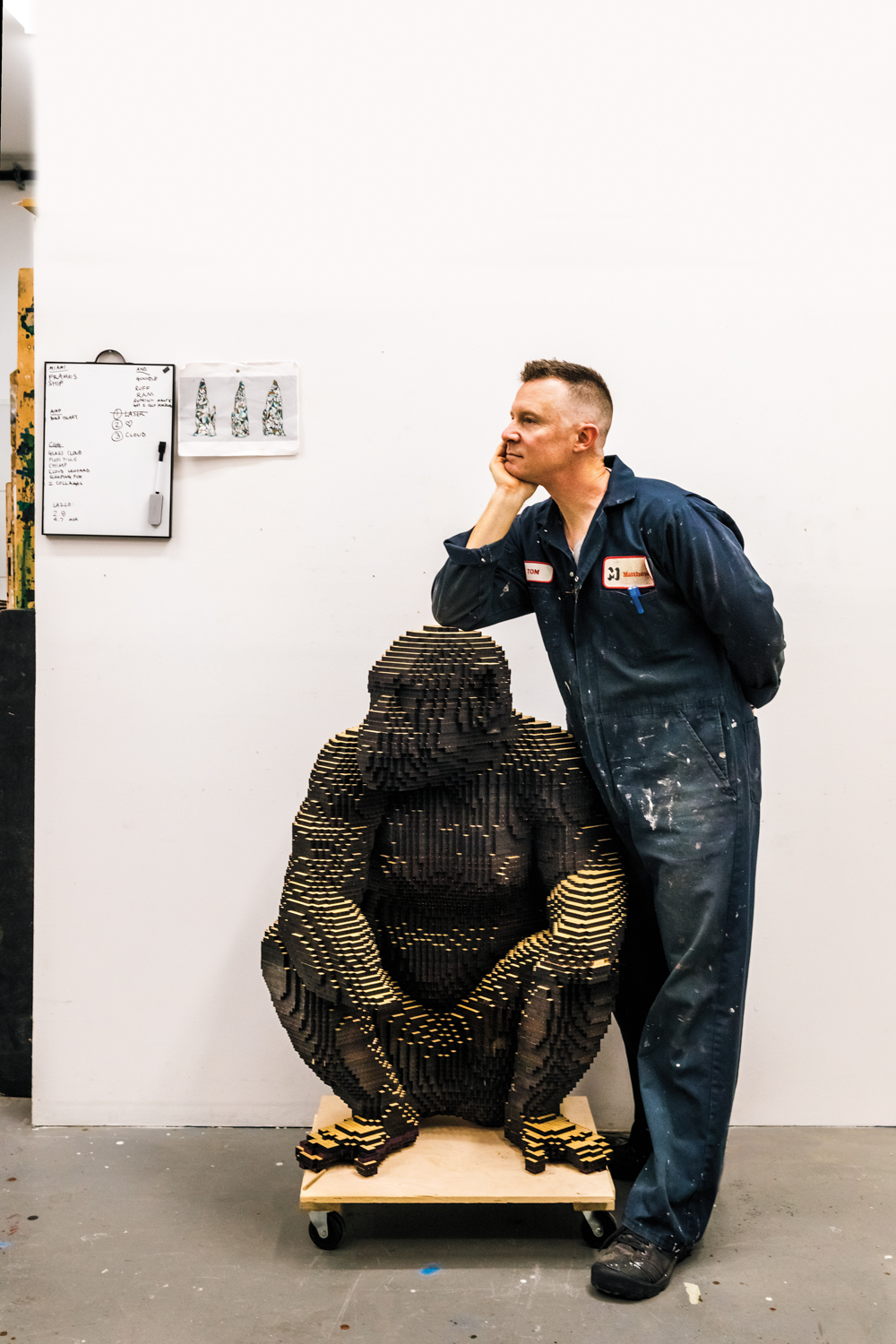 Shaun Smith with a sculpture of a chimpanzee