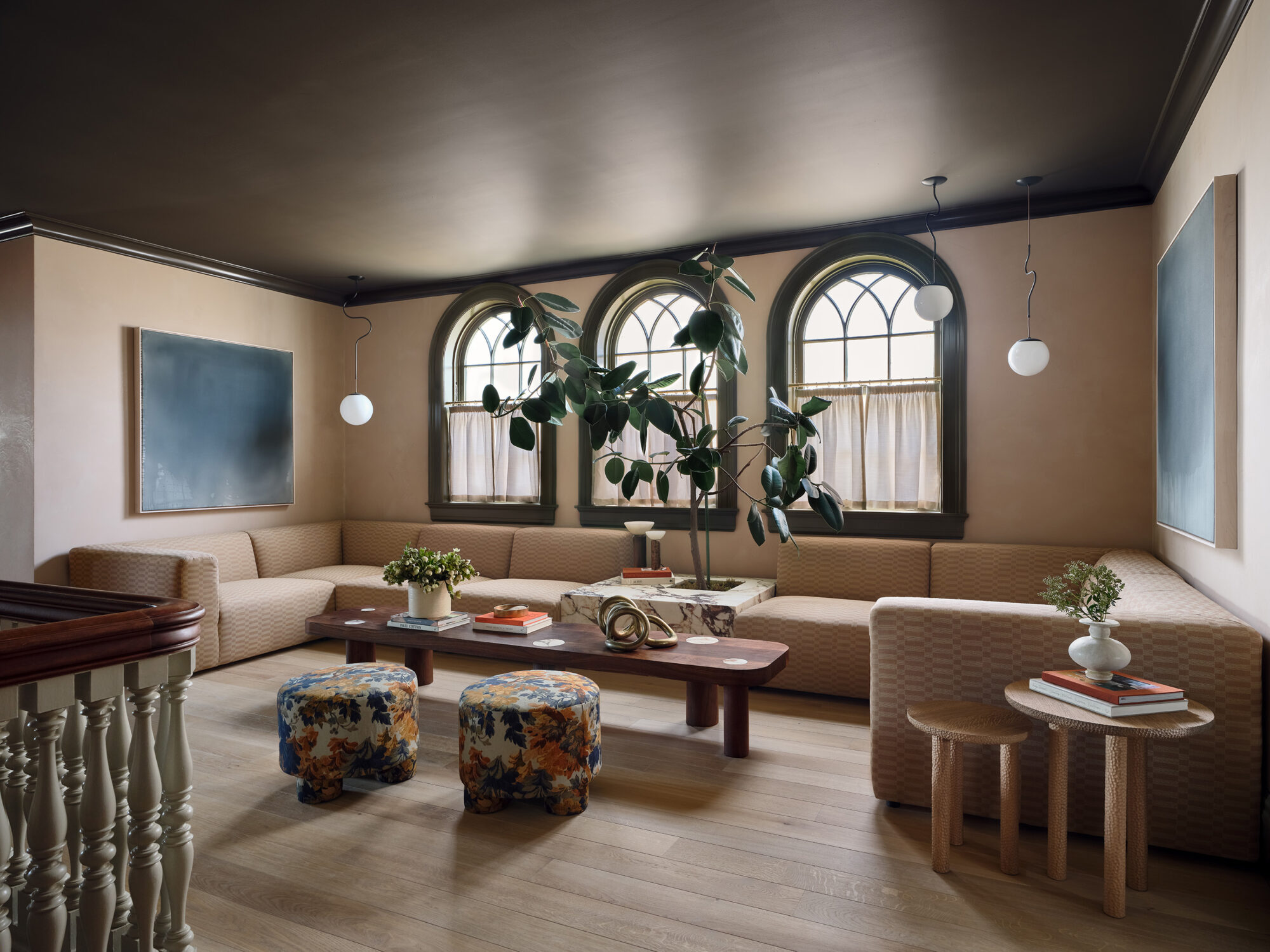 Sofa and coffee table under arched windows