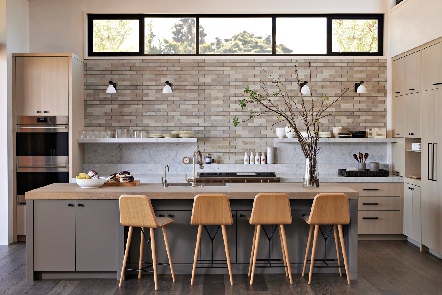 kitchen with neutral tone brick-like...