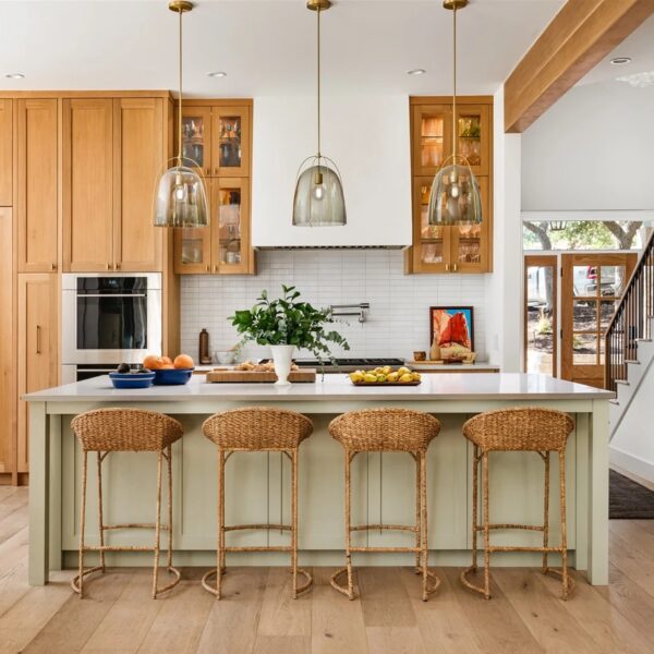 a kitchen with a island and stools