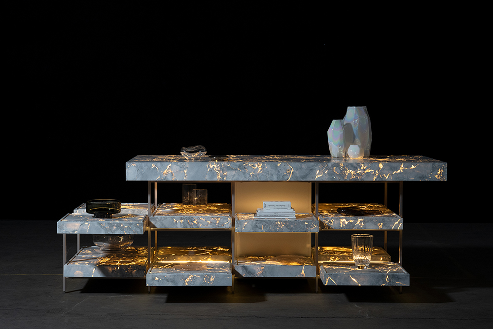 a kitchen setup made of natural stone with light coming through the cracks, as seen at Milan Design Week