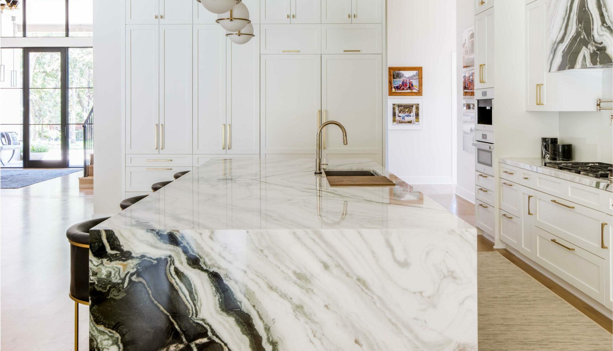 a kitchen with a marble island