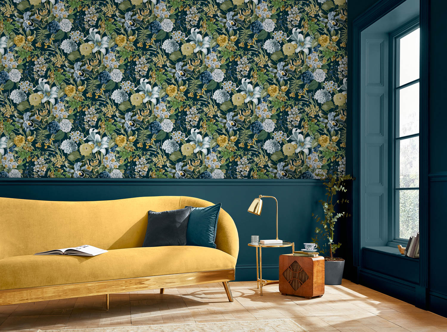 blue, green, and yellow floral wallpaper behind a yellow couch