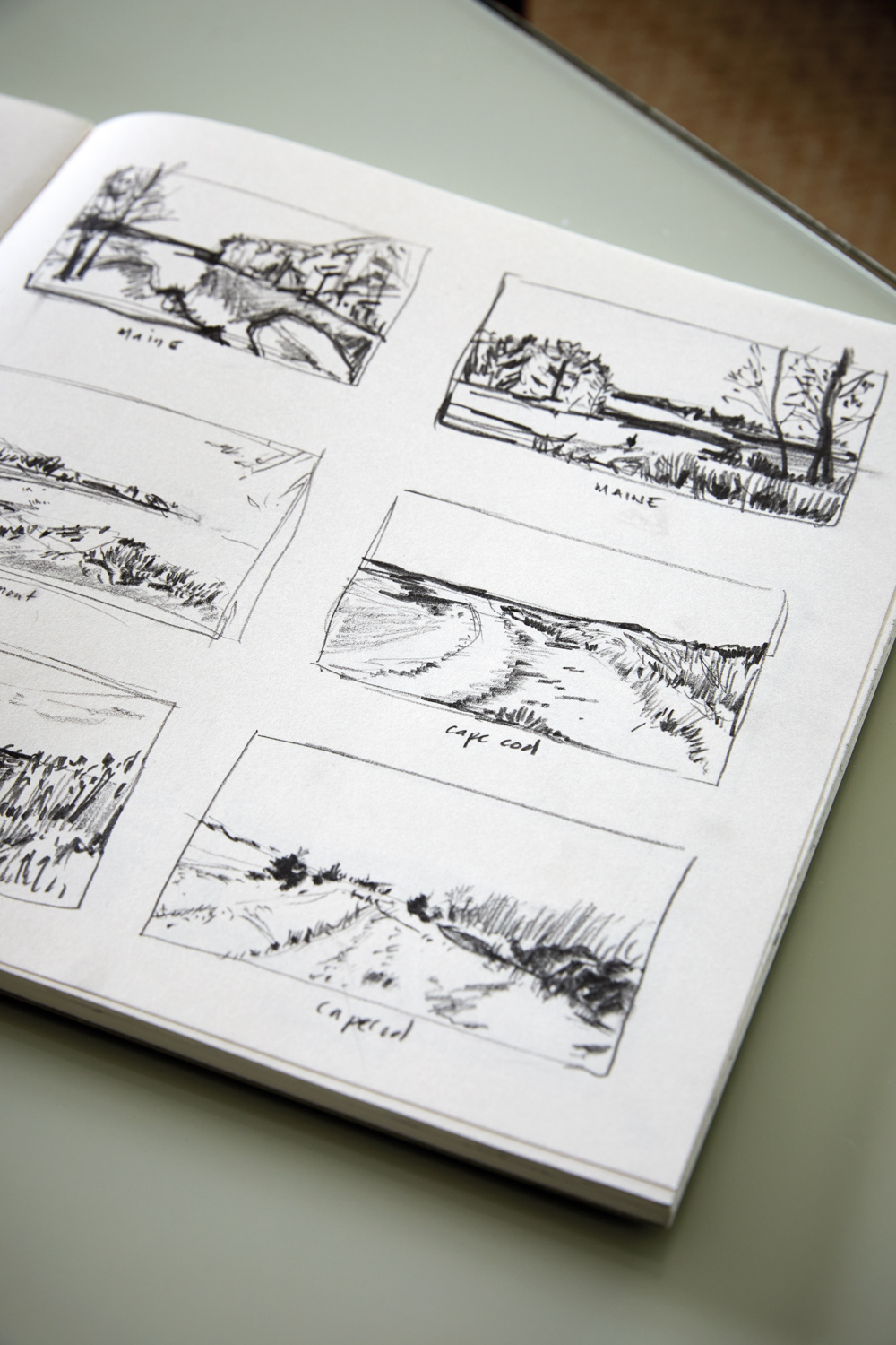 sketchbook with drawings of Maine and Cape Cod landscapes
