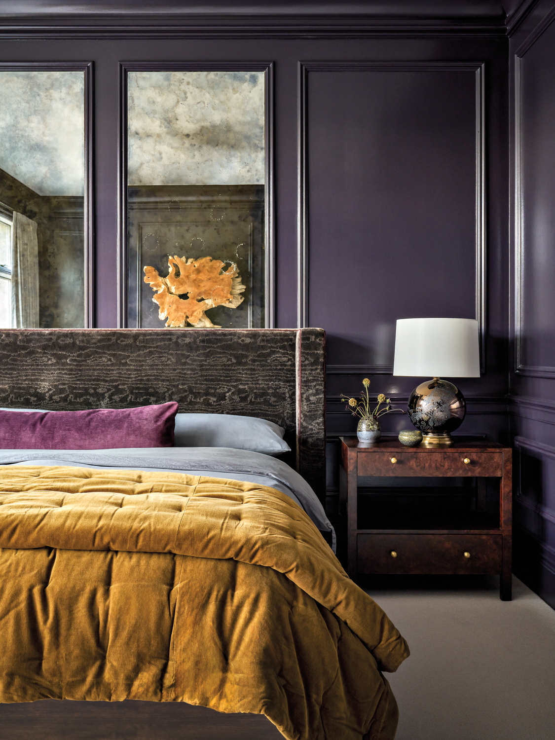 bedroom with purple walls and...