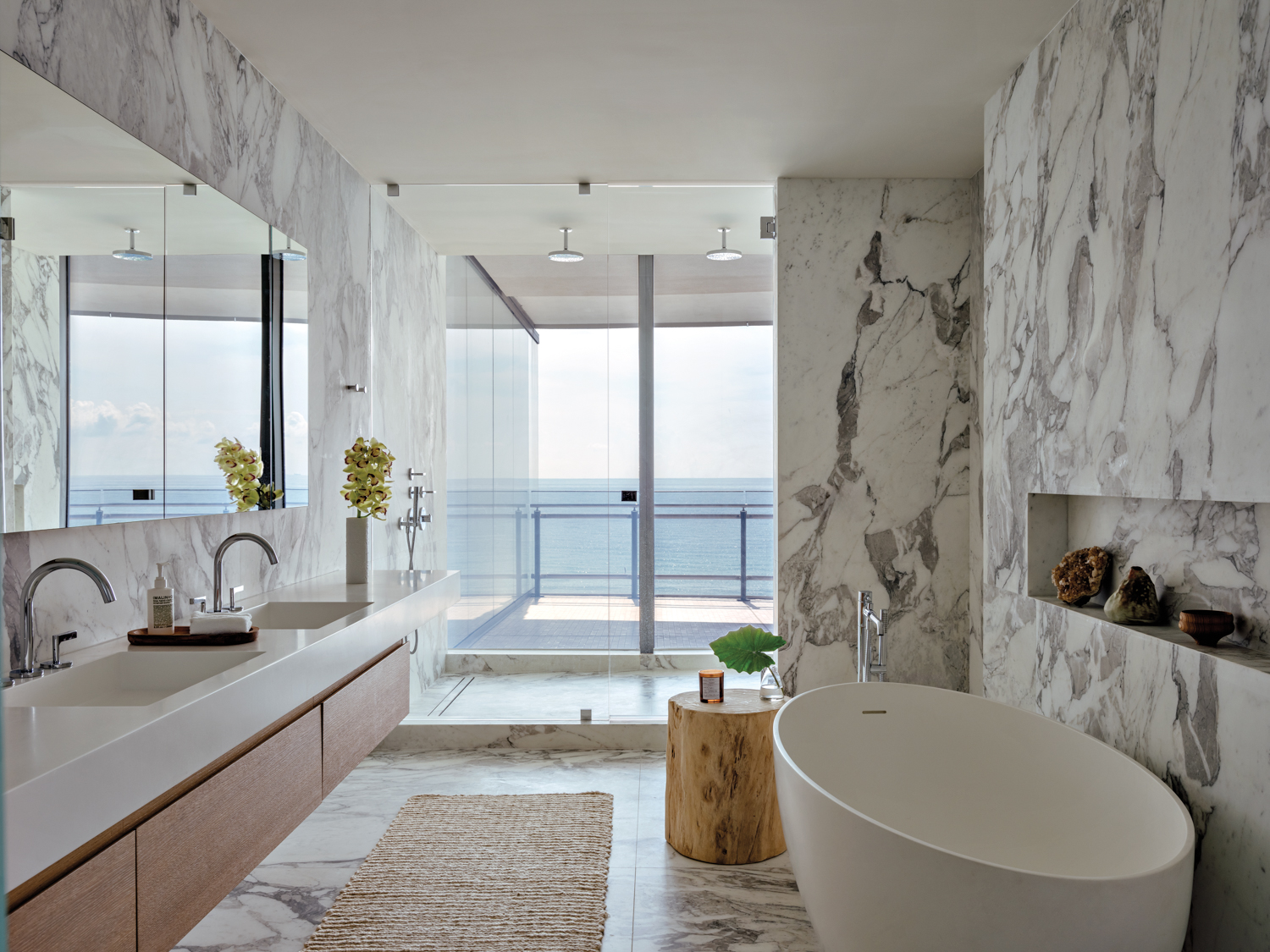 bathroom with marble walls and...