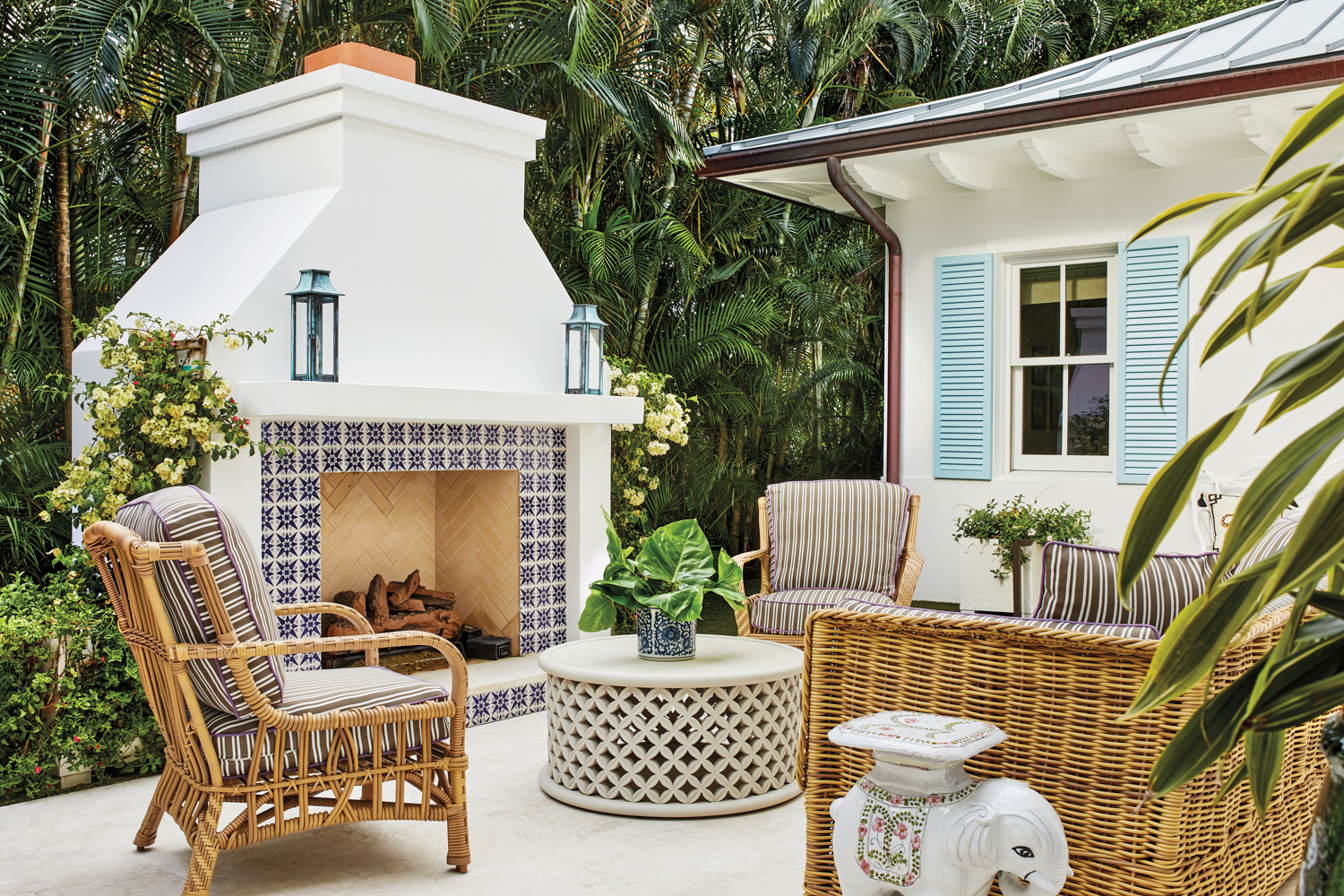 outdoor space with fireplace, rattan...