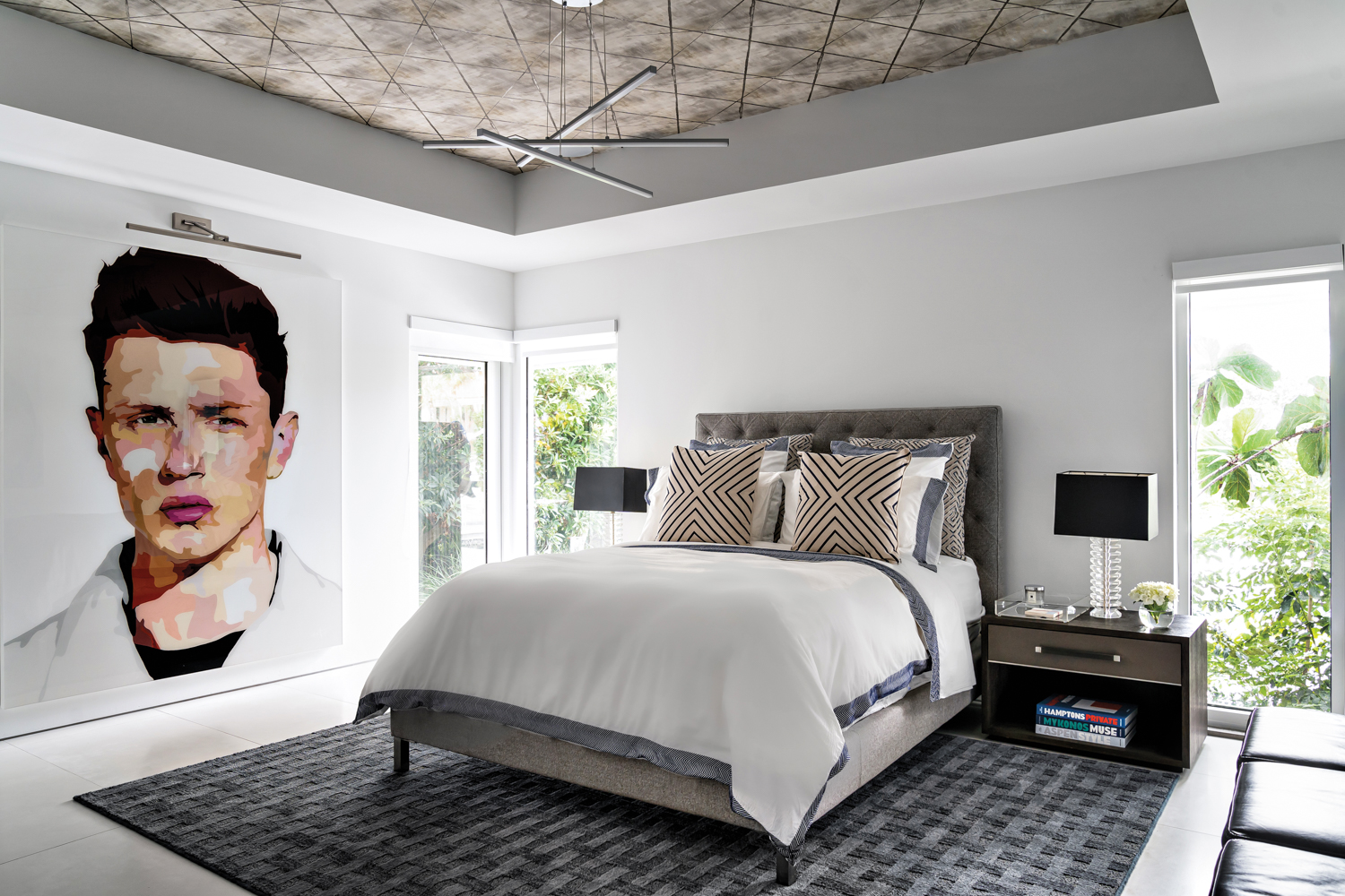 bedroom with large portrait, white...