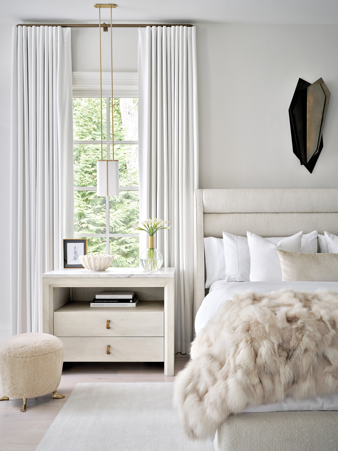 modern bedroom with channeled upholstered...