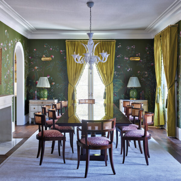 Dining room with moss green wallpaper, chartreuse draperies and pink dining chairs