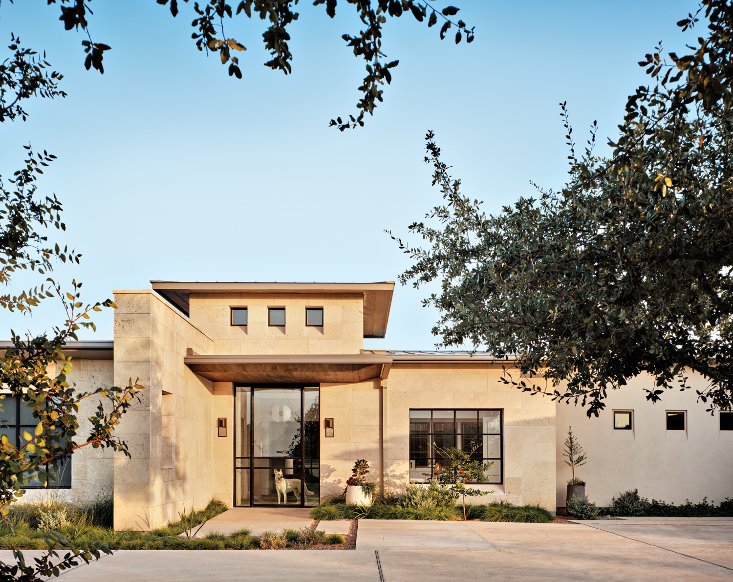 modern home exterior with limestone...