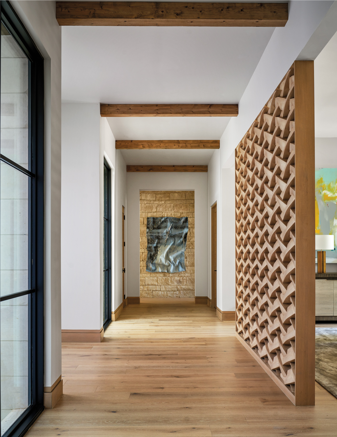 entryway with wooden screen and...