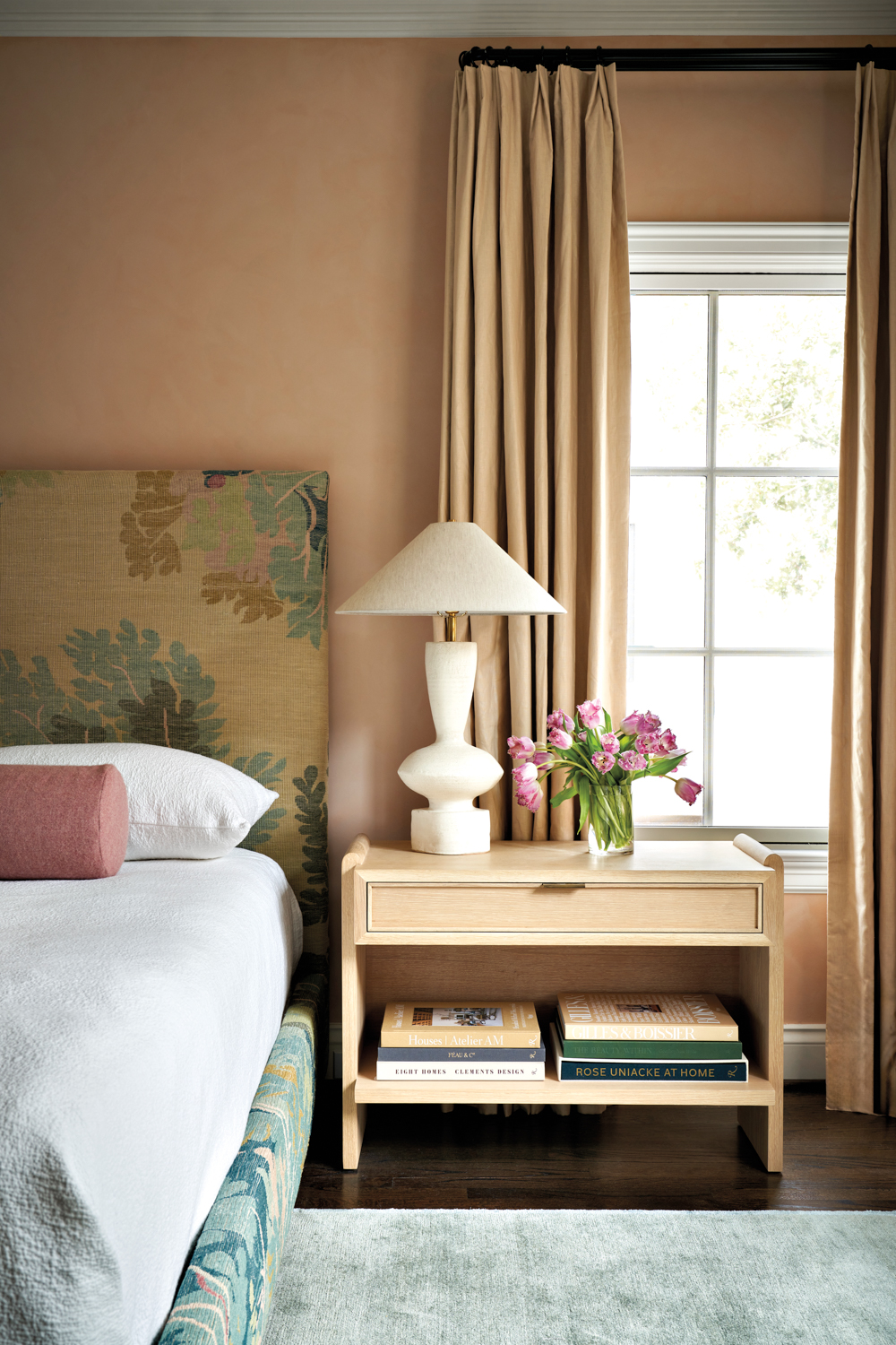 peachy pink bedroom with botanical...