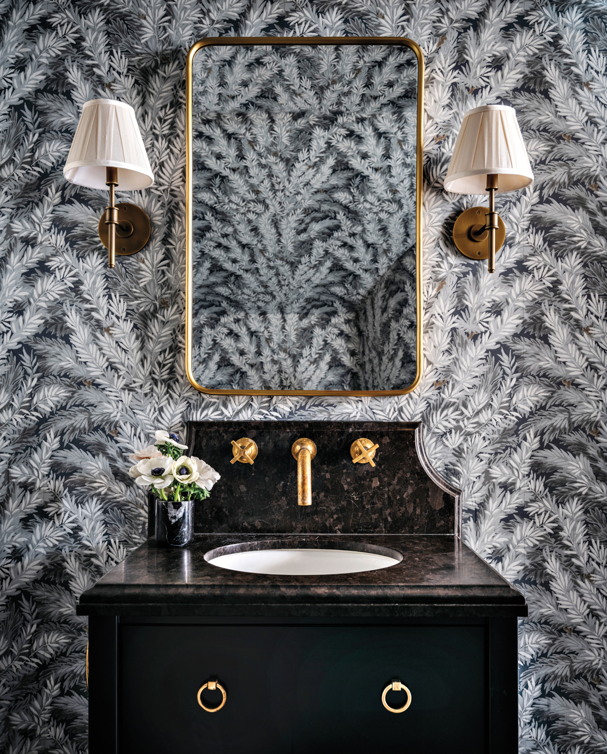 Powder room with leafy wallpaper