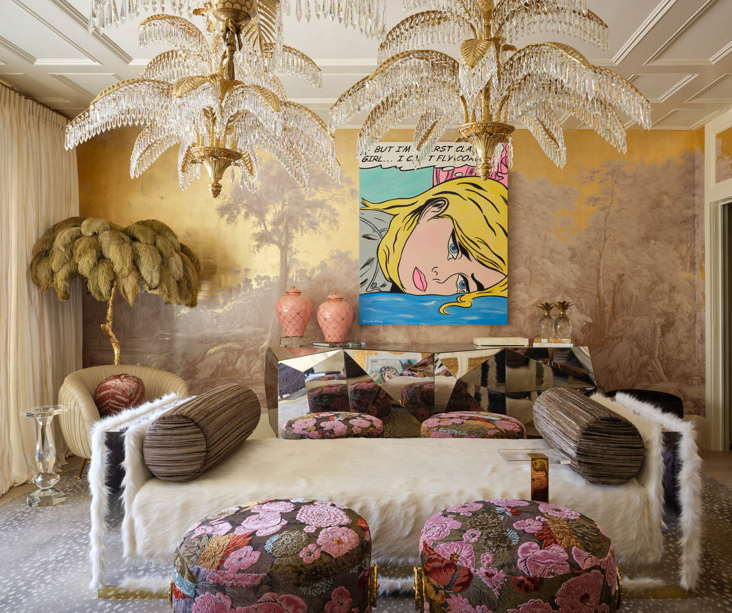 Elegant room with palm tree chandeliers, fur-covered seating, and floral-patterned stools. A pop art painting hangs above a mirrored table. Luxurious and artistic ambiance.