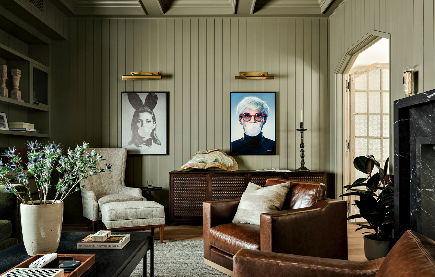 farmhouse den with light green walls and artwork by Michael Moebius