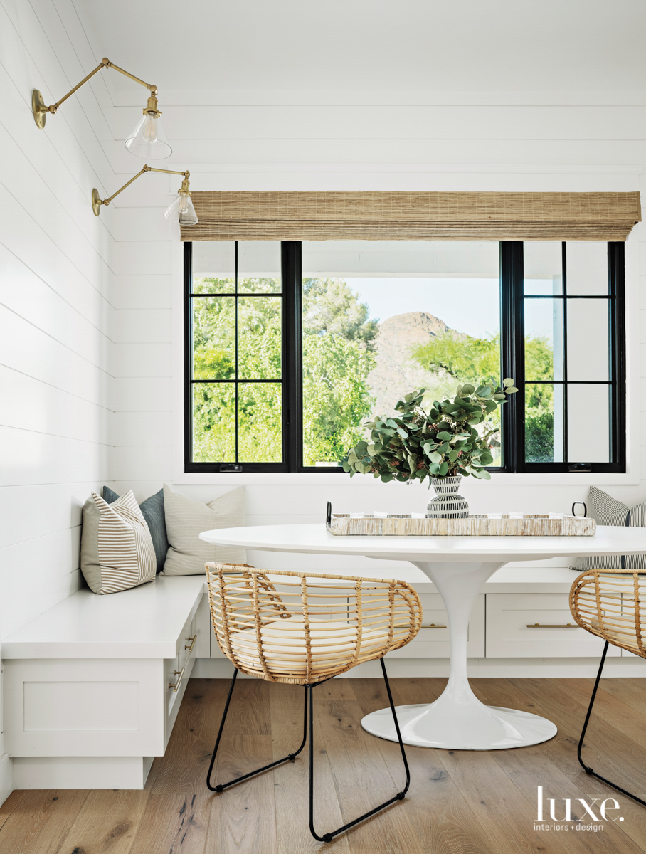 breakfast nook with a open window and bench seating and overhead lighting