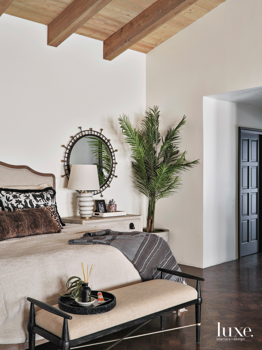 The master bedroom has an earthy color scheme and simple design pieces.