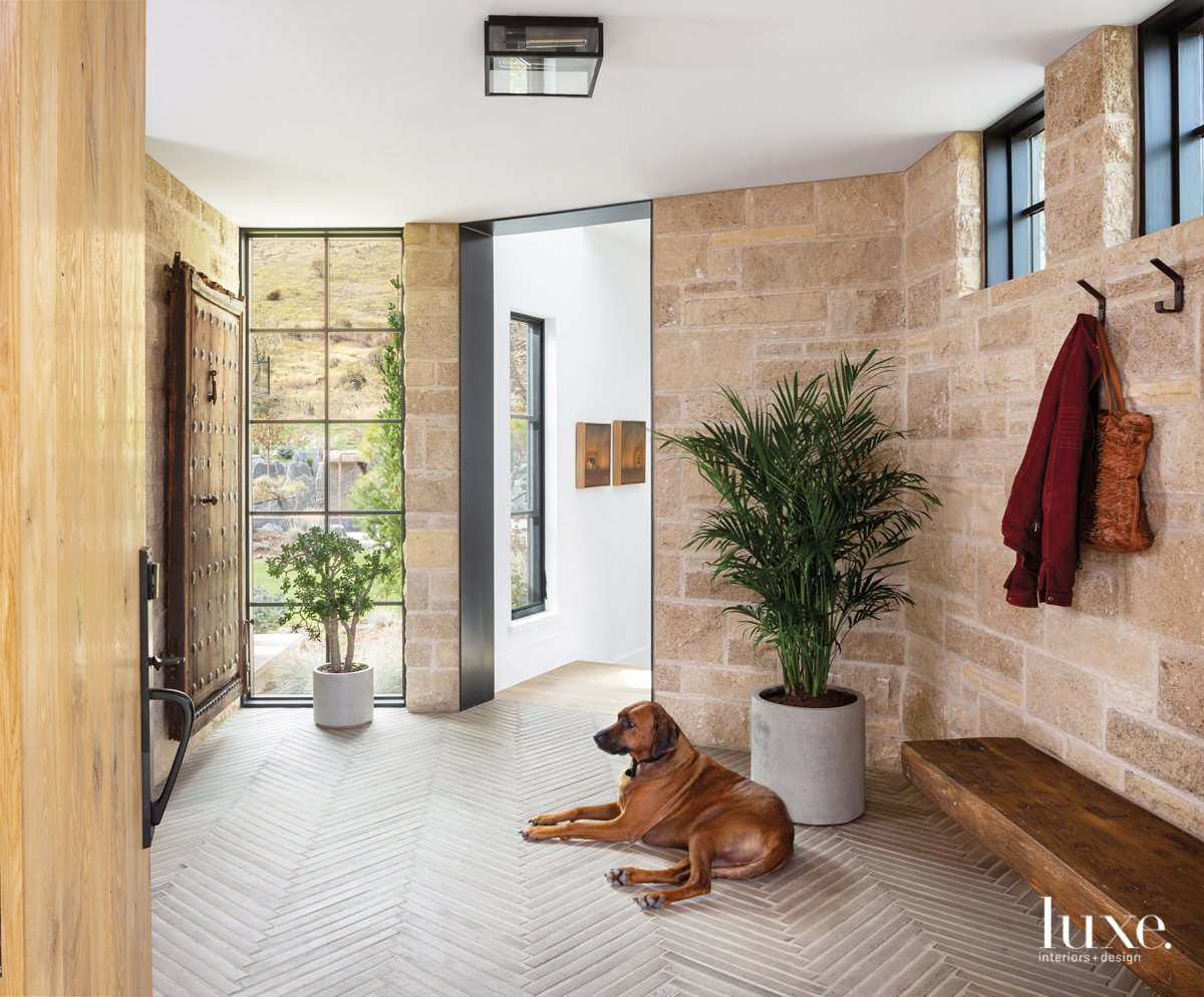 entry way from the front door featuring stand alon plants