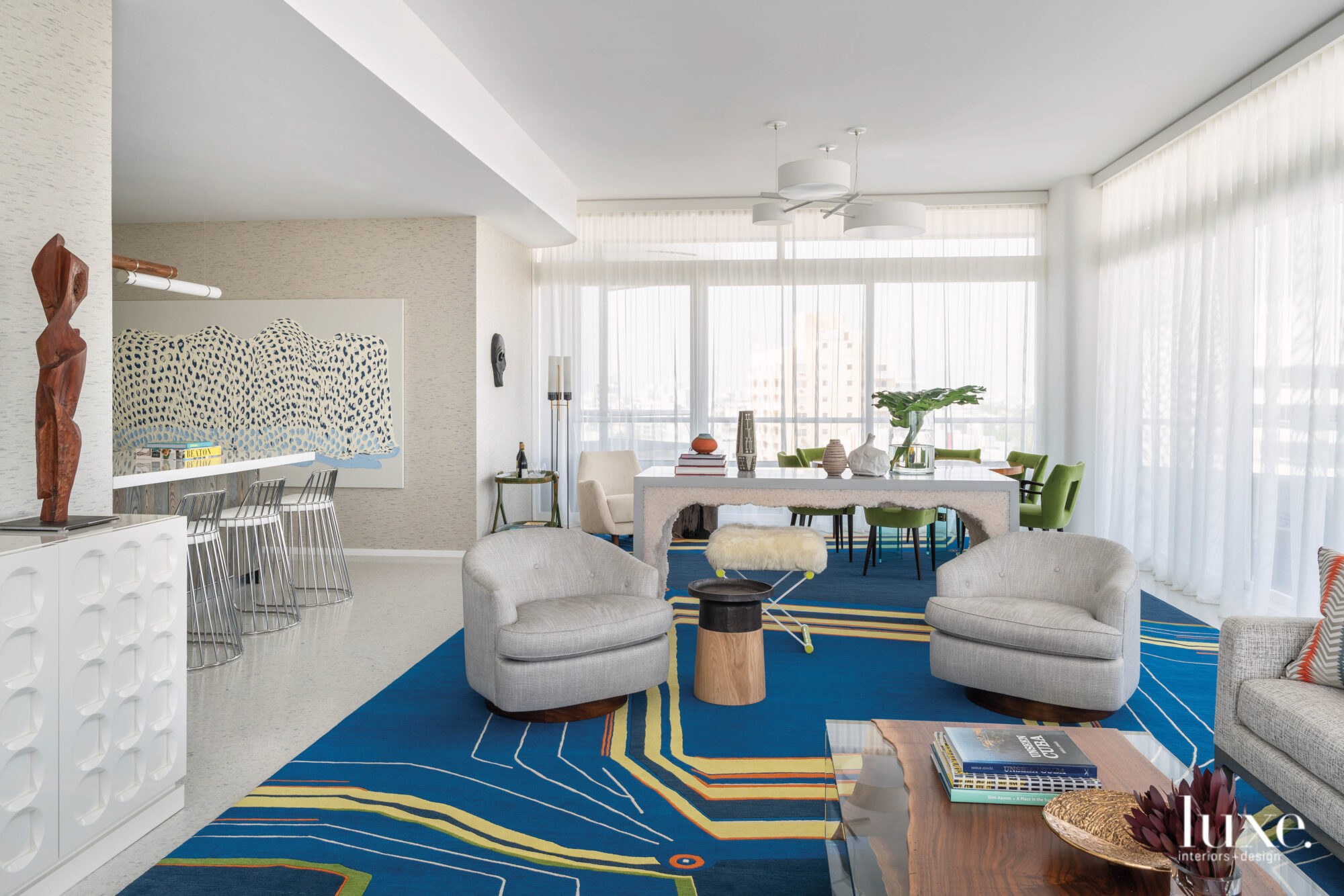 Great room with blue and yellow rug