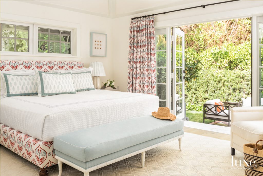 custom bed and draperies in bedroom with grasscloth wallcovering by thibaut